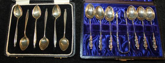 A set of six George V silver coffee spoons and a set of six silver apostle spoons and tongs